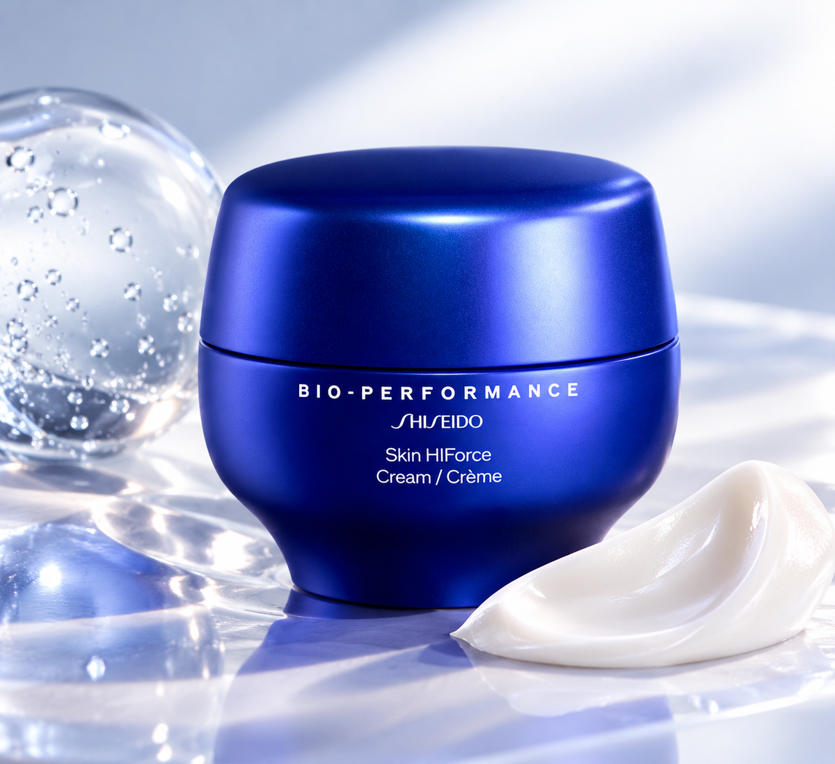 Shiseido Bio-Performance Skin HIFOrce Cream in a luxurious metallic blue jar, displayed on a glossy reflective surface with a rich white cream texture and transparent gel bubbles. Premium anti-aging facial moisturizer presented in a fresh, elegant blue and silver skincare setting.